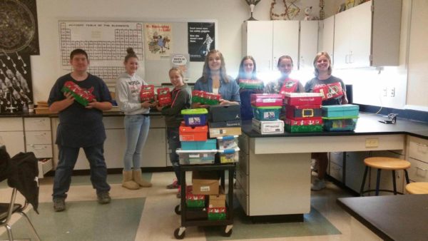Members of the Faith in Action Club helping with, "Operation Christmas Child."